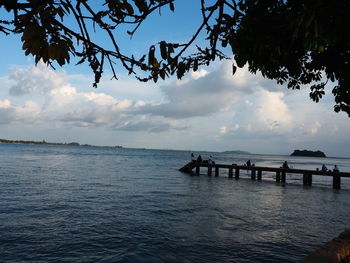 Pier over sea against sky