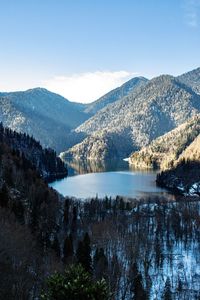 Scenic view of lake and mountains against sky