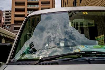 Reflection of buildings on glass window