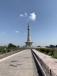 View of communications tower against cloudy sky