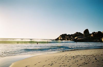 Scenic view of beach against clear sky