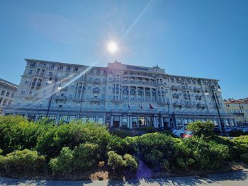 Buildings against clear blue sky