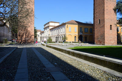 Buildings in city against clear sky