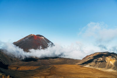 View of volcanic landscape against sky