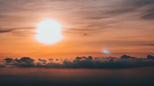 Scenic view of landscape against romantic sky at sunset