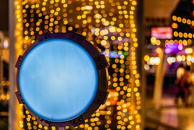 Close-up of illuminated light on table
