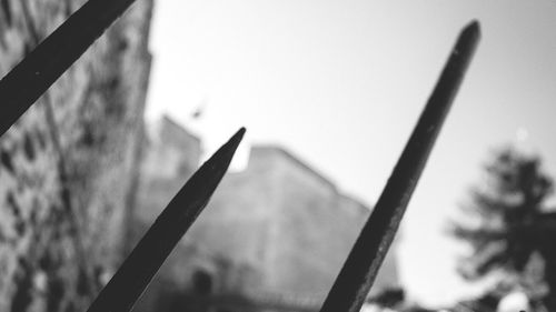 Low angle view of pole against blurred background
