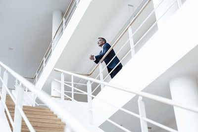 Low angle view of man on staircase