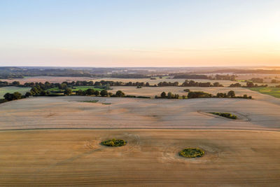 Scenic view of landscape against sky during sunset