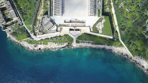 Aerial view of buildings by sea