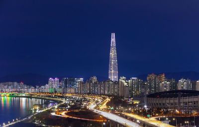 Illuminated buildings in city at night