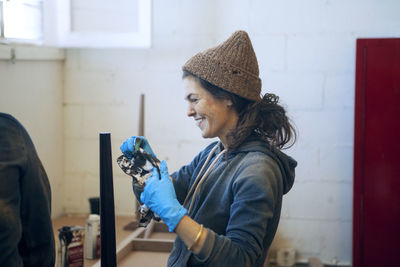 Side view of woman photographing