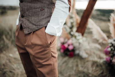 Rear view of man standing on field