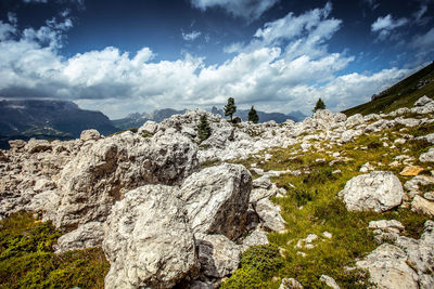Scenic view of rocks and mountains against sky