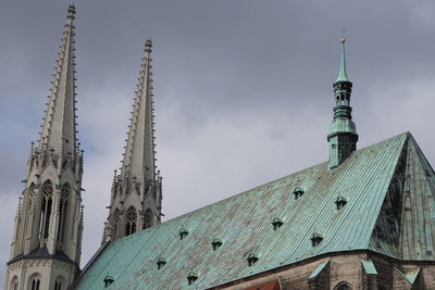 High section of building against cloudy sky