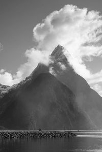 Scenic view of mountains against cloudy sky