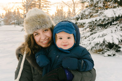 Portrait of mother and son in winter