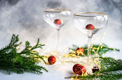 Christmas and new year eve party celebration with champagne glasses and lights