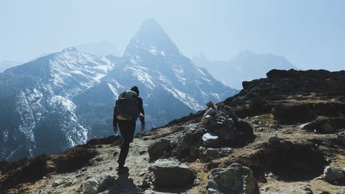 Man hiking on rocky mountain