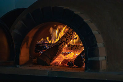 Close-up of fire burning on wood