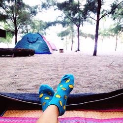 Low section of woman wearing multi colored tent