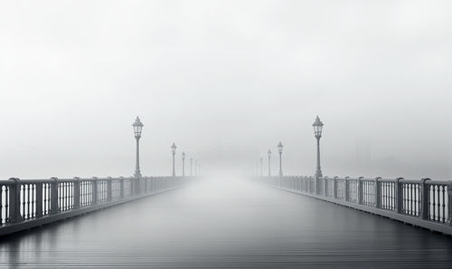 Pier over sea against clear sky