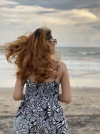 Woman standing at beach 