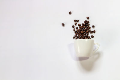 Close-up of coffee cup against white background