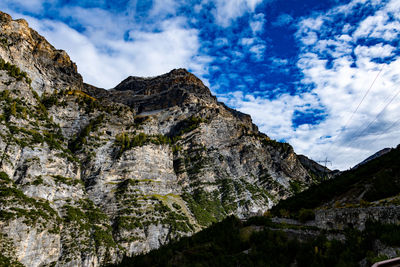 Low angle view of rock formation against sky