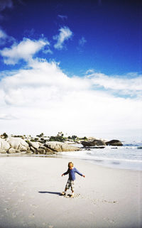 Full length of woman standing on beach