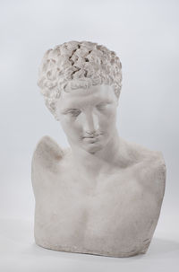 Close-up of statue against white background