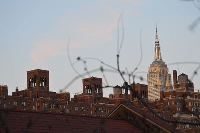 Buildings in city against sky