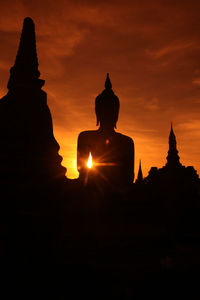 Silhouette of temple at sunset