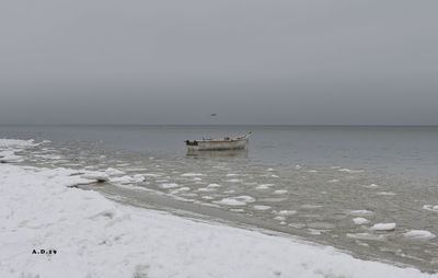 Scenic view of sea against sky during winter