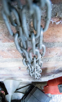 High angle view of chain on wall