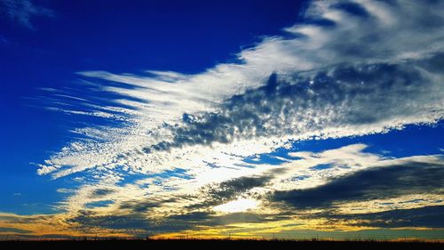 Scenic view of landscape against blue sky