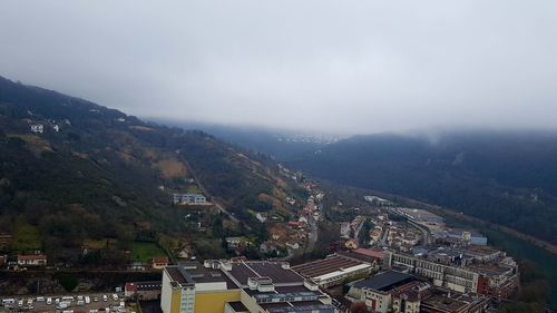Aerial view of cityscape against sky