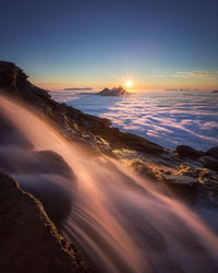 Scenic view of sea against sky during sunset