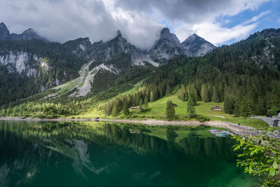 Scenic view of lake and mountains against sky