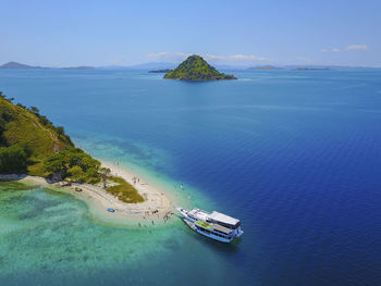 High angle view of boats on sea shore against sky