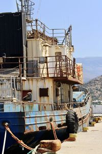 Low angle view of refugees ship against sky