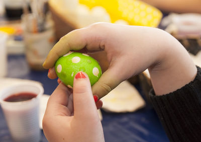 Close-up of hand holding lemon