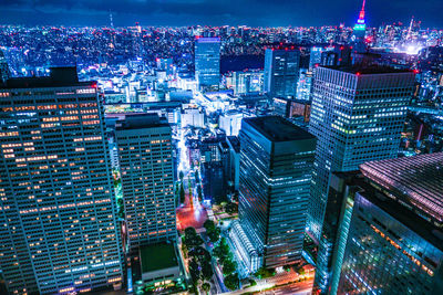 High angle view of illuminated buildings in city at night