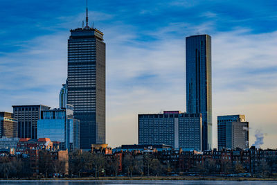 Modern buildings in city against sky