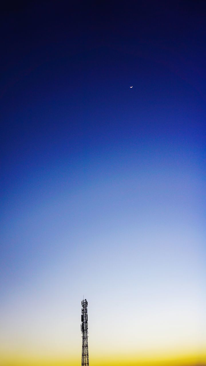 LOW ANGLE VIEW OF COMMUNICATIONS TOWER AGAINST SKY