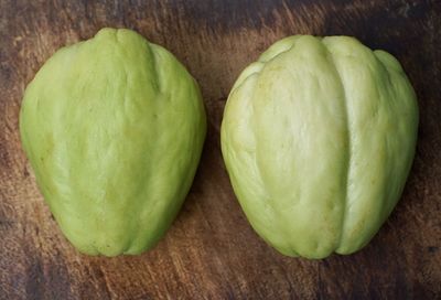 Close-up of green fruits on table