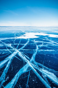 Aerial view of landscape against blue sky