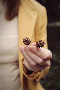 Close-up of hand holding flower