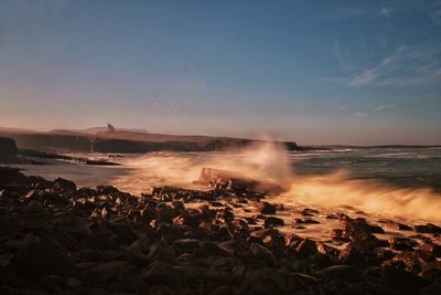 Scenic view of sea against sky during sunset