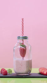 Close-up of fruits in glass jar on table